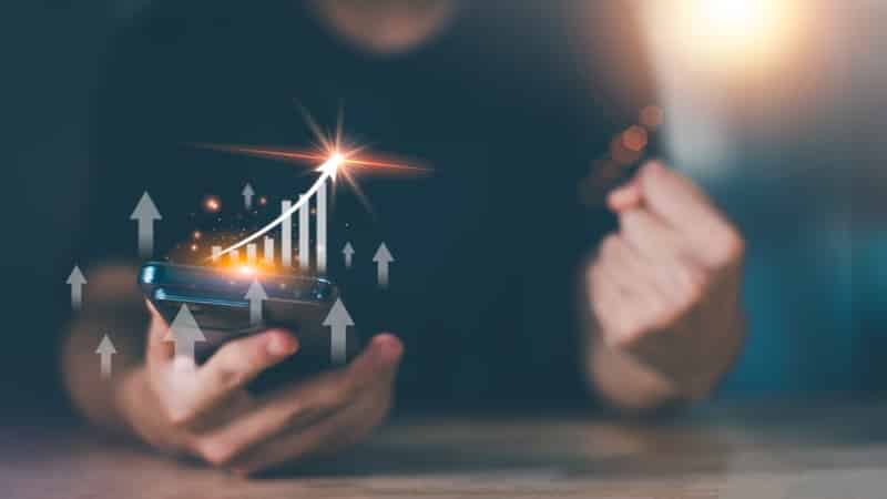 Businessman showing business growth and success graph ,concept o Manage Your Casino Finances