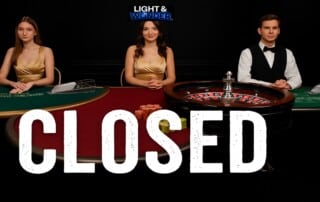 Light and Wonder live casino dealers at closed gaming tables with roulette wheel and card games