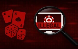 Magnifying glass examining computer monitor displaying illegal gambling site with casino chips, dice and playing cards in red tones