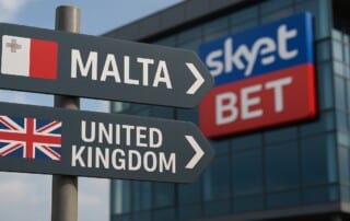 Directional signs showing Malta and United Kingdom with SkyBet logo representing gambling operator's relocation from UK to Malta