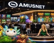 Amusnet exhibition stand at ICE Barcelona 2026 showcasing 10-year anniversary with slot game displays, Oscar the Gobbler mascots, and live dealer roulette table