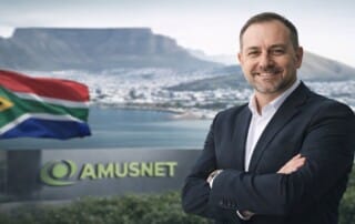 Cameron Green appointed as Amusnet Country Manager for South Africa with Table Mountain and South African flag in background