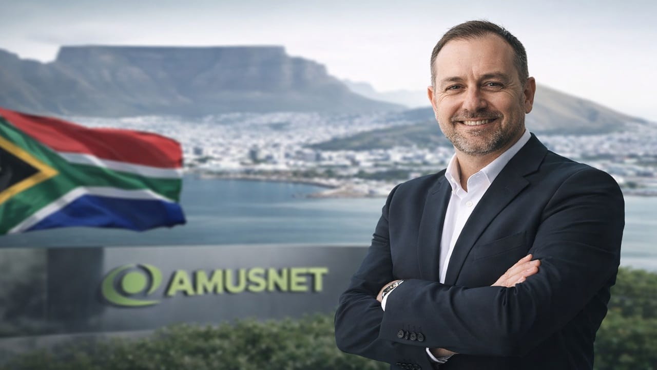 Cameron Green appointed as Amusnet Country Manager for South Africa with Table Mountain and South African flag in background