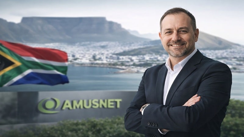 Cameron Green appointed as Amusnet Country Manager for South Africa with Table Mountain and South African flag in background