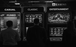 BGaming gaming machines displaying Casual, Classic, and Entertainment categories at ICE Barcelona 2026 trade show with Plinko, slot games, and Snoop Dogg Dollars visible