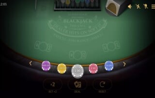 BGaming Surrender Multihand Blackjack game showing green felt table with betting chips and three hand positions