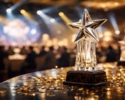 Crystal star trophy at the International Gaming Awards ceremony with golden stage lighting