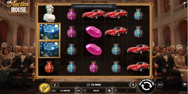 The Auction House Slot Game | Betsoft – Weekly Review The Auction House slot reels with marble bust, framed paintings, sports car and jewelled egg symbols, set inside a luxury auction room with formally dressed bidders.