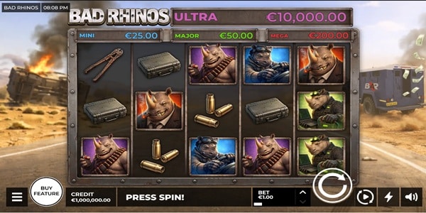 Bad Rhinos Ultra Slot Game | BetGames – Weekly Review Bad Rhinos Ultra slot reels showing rhino character symbols, ammunition, cases and jackpot values on a desert road game screen.